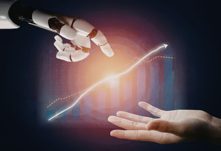 Robot hand and human hand working together to achieve success and growth in a digital economy with a glowing graph trending upward.の写真素材