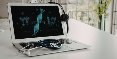 Silver laptop on white desk displays a digital dna double helix model with a stethoscope resting on...