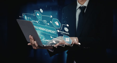 A businessman in a suit holds a digital tablet with a futuristic infographic floating above it,...