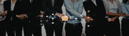 a group of people standing in a line, all dressed in business attire, holding champagne glasses and...