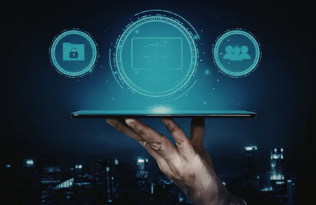 a person's hand holding a tablet with three glowing blue icons floating above it, against a...