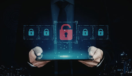 A man in a suit holds a tablet with a large red lock icon and smaller blue lock icons, symbolizing...