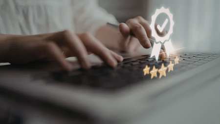 a person is sitting at a desk and giving a glowing rating on their laptop keyboard the rating is...