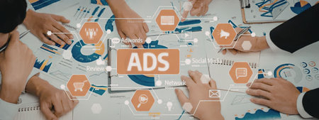 Business professionals collaborate on online advertising strategies using charts, graphs, and...