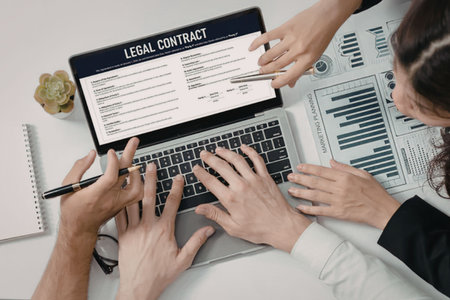 Multiple business professionals' hands meticulously review a digital legal contract displayed on a...
