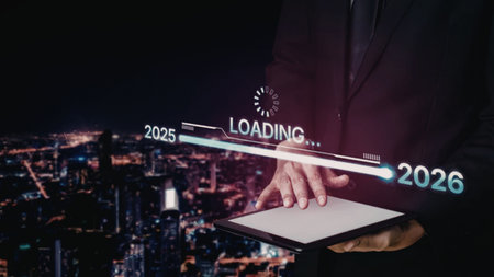 Businessman holds tablet showing loading bar transitioning from 2025 to 2026 over a vibrant...