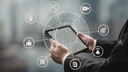 Businessman in suit interacts with smartphone and digital interface showcasing various icons...