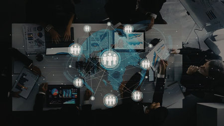 Business professionals collaborating around a table with a global network overlay, symbolizing...