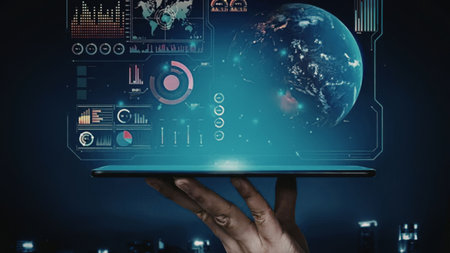Human hand holds a sleek tablet projecting a vibrant holographic globe surrounded by intricate...