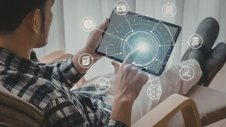 Man relaxing comfortably touches glowing digital tablet displaying connected charts and business...