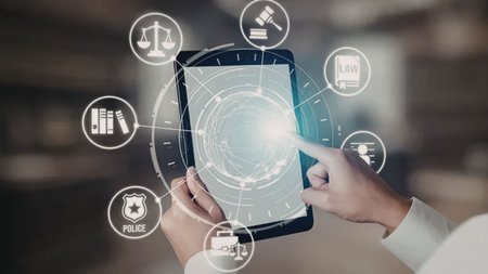 Person interacts with tablet displaying digital justice system interface surrounded by icons...