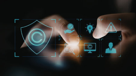 Hands interact with a futuristic digital interface displaying a shield and various security icons...