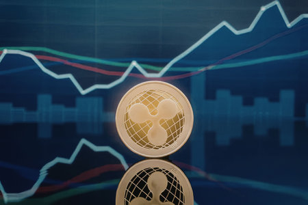 A gold coin with a graph and chart lines in the background, representing cryptocurrency trading and market trends.