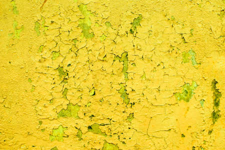 Yellow texture for designer background. Colorful background. Abstract background of cracked old...