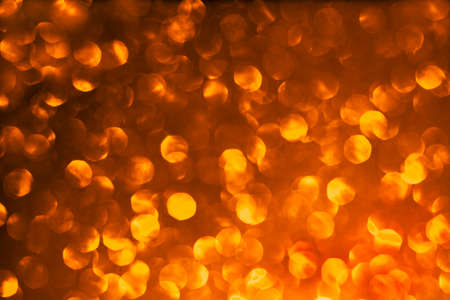 Blurred abstract gold glitter texture, defocused christmas lights. Holiday christmas concept.