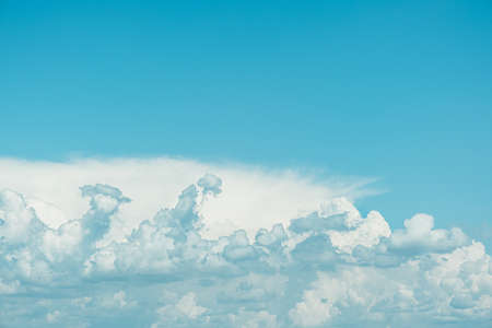Beautiful blue sky with amazing white clouds. Nature background. Place for text.の写真素材