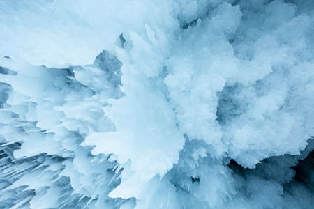 Ice cave with huge icicles on the Lake Baikal in winter. Siberia, Russia.の写真素材