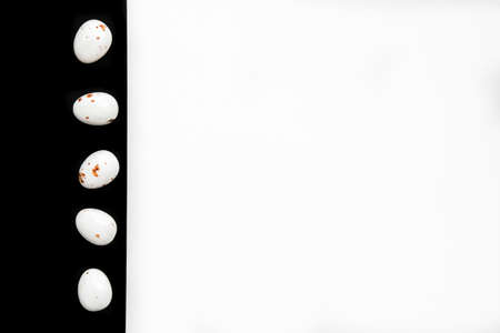 Easter minimal composition with multicolored eggs on the white black background. Easter concept....
