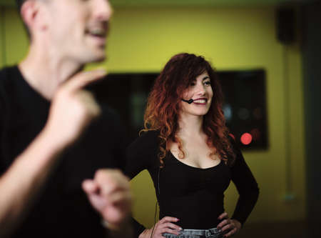 A young woman and a man teaching Salsa and Bachataの写真素材
