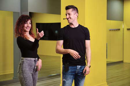 A young woman and a man teaching Salsa and Bachataの写真素材