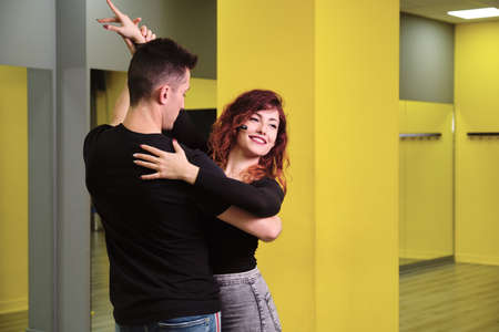 A young woman and a man teaching Salsa and Bachataの写真素材