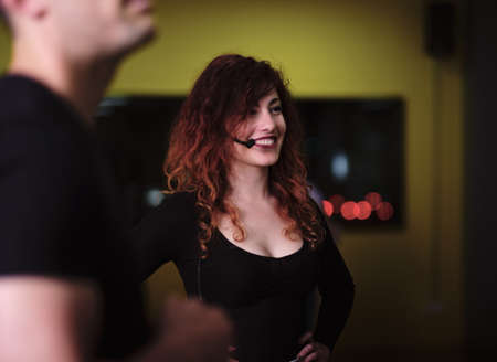 A young woman and a man teaching Salsa and Bachataの写真素材