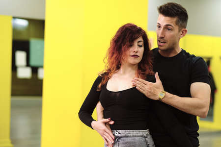 A young woman and a man teaching Salsa and Bachataの写真素材