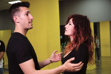 A young woman and a man teaching Salsa and Bachataの写真素材