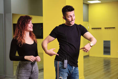 A young woman and a man teaching Salsa and Bachataの写真素材