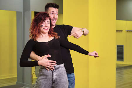 A young woman and a man teaching Salsa and Bachataの写真素材