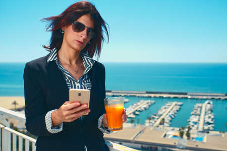 young executive woman using her mobileの写真素材