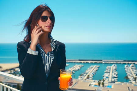 young executive woman using her mobileの写真素材