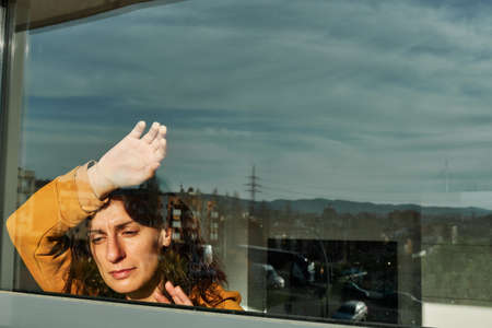 A young woman during confinment, quarentine by coronavirus - virus conceptの写真素材