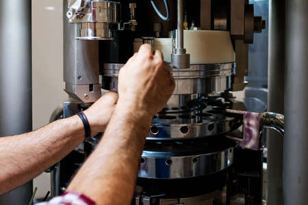 industrial machine close up and industrial workerの写真素材