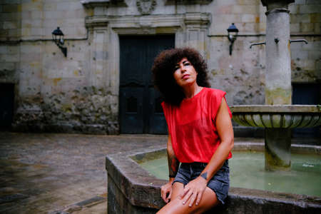 mature woman in Sant Felip Neri square in Barcelonaの写真素材