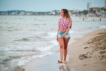 young woman at the beach on a summer day
