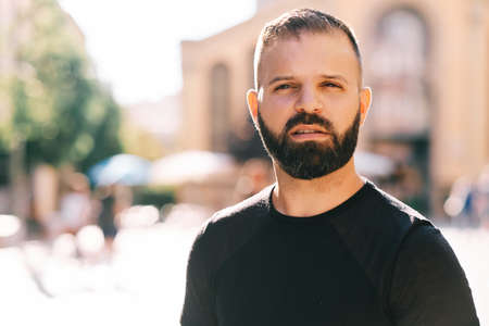 adult man with beard outdoors