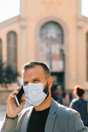 adult man in grey casual suit with mask and social distance - coronavirus conceptの写真素材