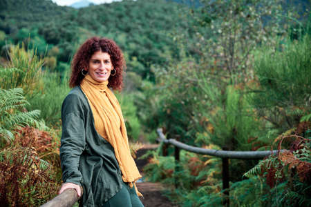 adult woman in a forest - autumn concept