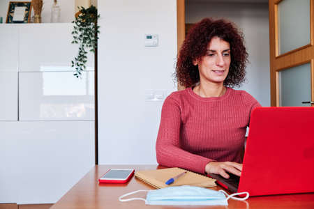 woman at home studying - stay home conceptの写真素材
