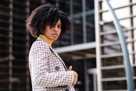 African american woman standing outdoors.の写真素材