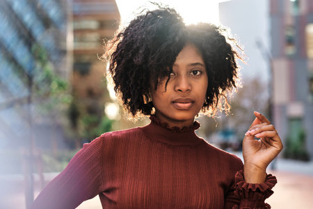 African American woman outdoors on the street.の写真素材