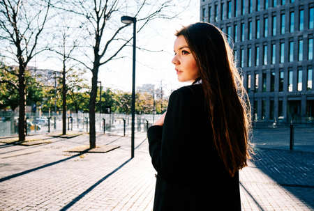 Business woman walking outdoors on the street.の写真素材