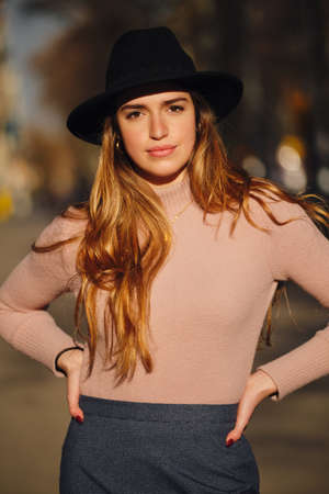 Woman standing outdoors on the street.