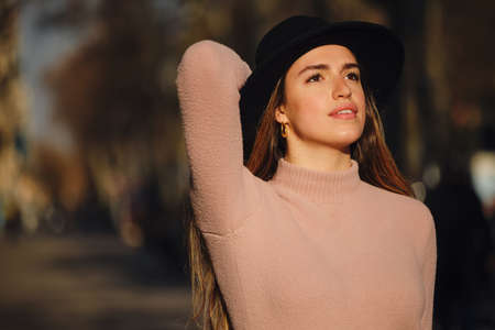 Woman standing outdoors on the street.の写真素材