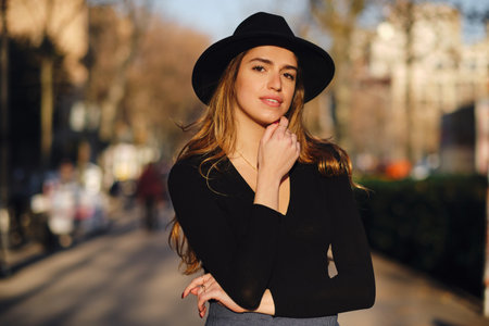 Woman standing outdoors on the street.の写真素材