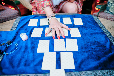 cards that will tell the future with hands of a mature woman on them