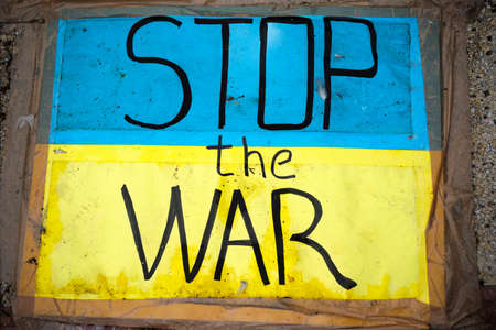Stop the war sign on the floor with Ukraine flag colorsの写真素材