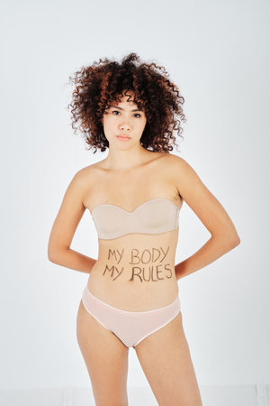 Undressed female model with My Body My Rules inscriptionの写真素材