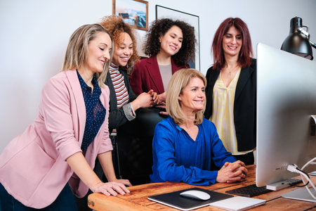 Business colleagues having an online meeting while working together in the office.の写真素材